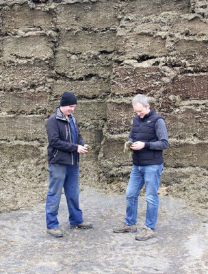Alistair Logan and another man by the silage clamp