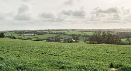 Rain clouds over the fields at Treveale Farm